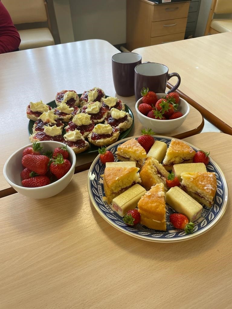 Plates of strawberries and scones